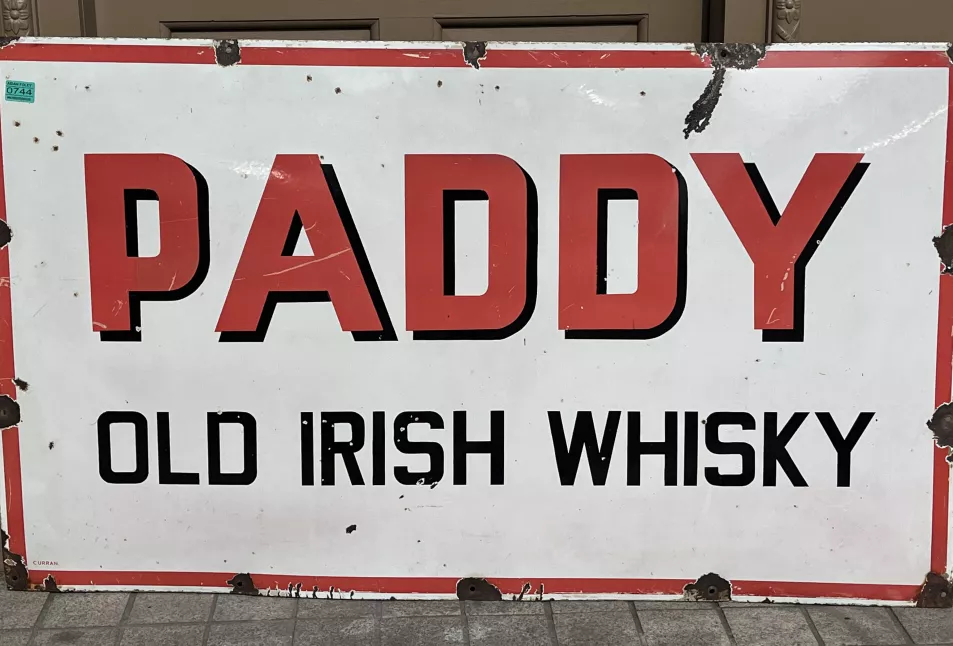 An original enamel Paddy Old Irish Whisky sign, predating Paddy’s change to the Irish spelling of whiskey
