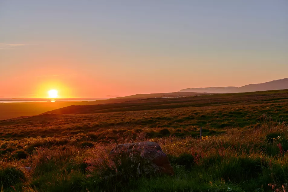 A midnight sunset in Skagafjordur, Iceland (Alamy/PA)