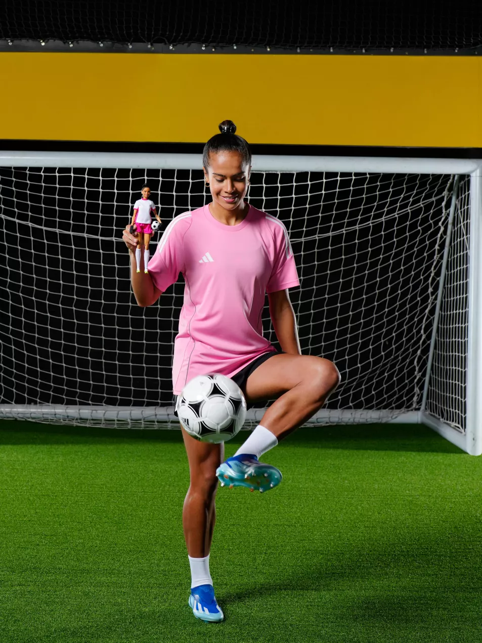 Manchester City footballer Mary Fowler poses with Barbie doll