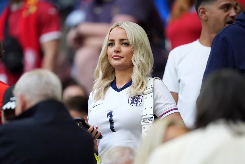 Megan Davison, wife of England goalkeeper Jordan Pickford, wearing an England top in the stands
