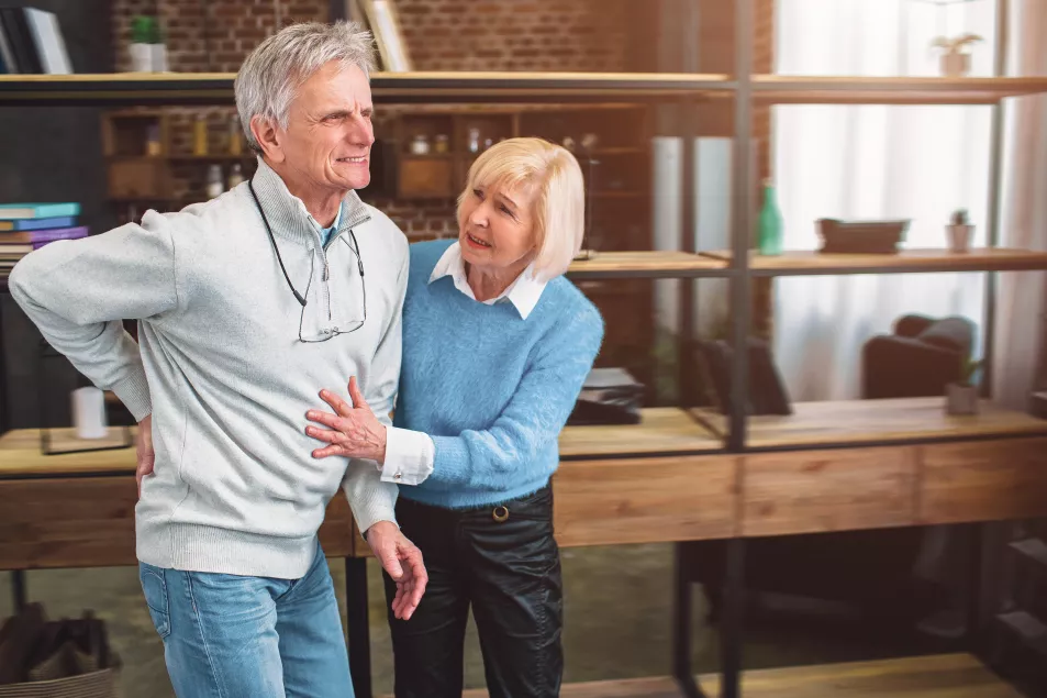 A picture of old man keeping his hand on the back