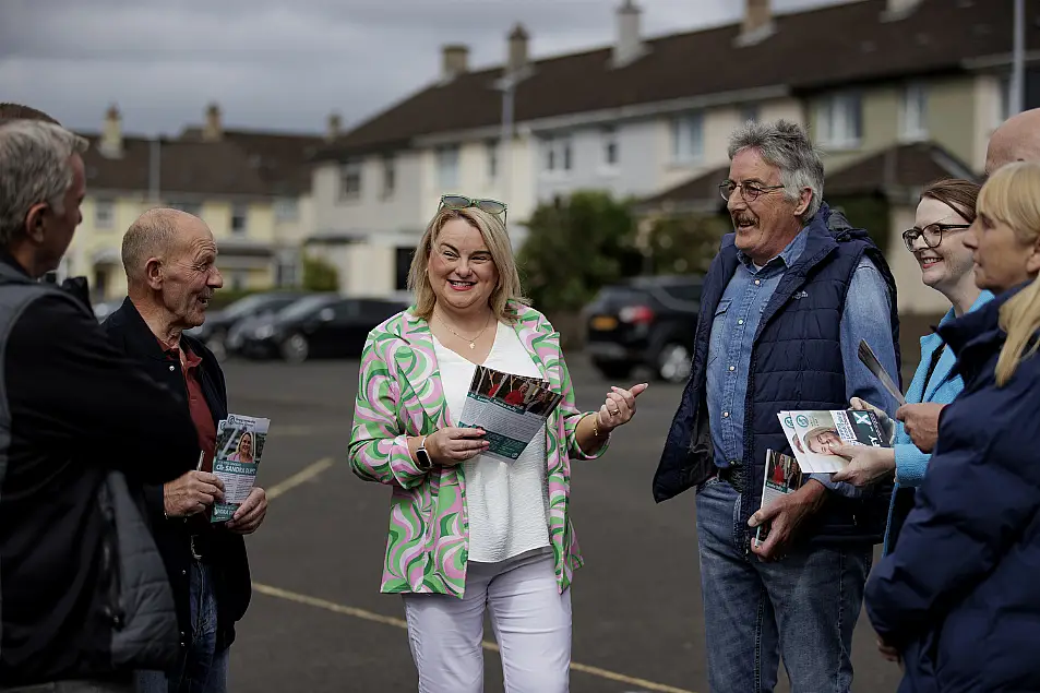 Sandra Duffy holding leaflets in the street