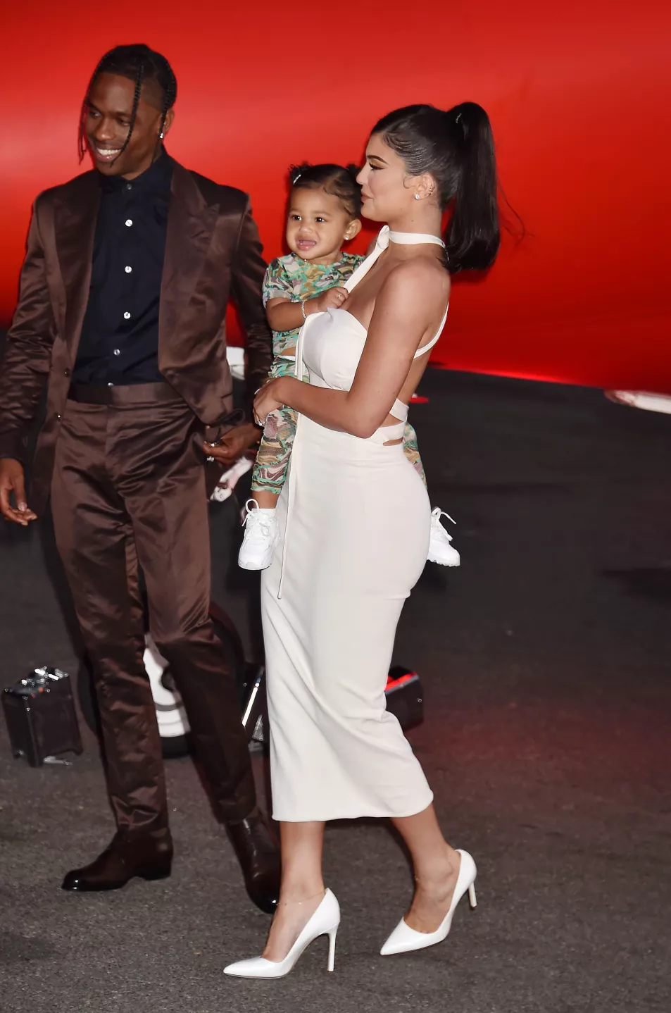 Travis Scott, Stormi Webster and Kylie Jenner attend the Travis Scott: "Look Mom I Can Fly" Los Angeles Premiere at The Barker Hanger in 2019 