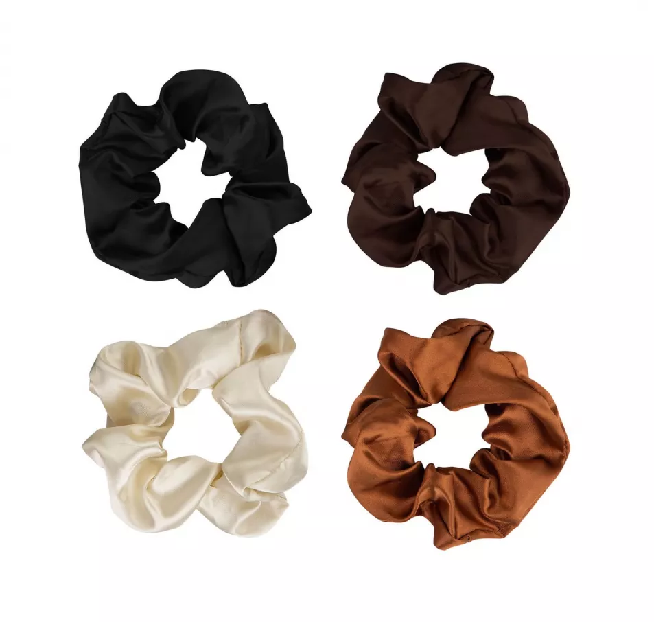 Four nude coloured silk scrunchies in black, deep brown, caramel and ivory