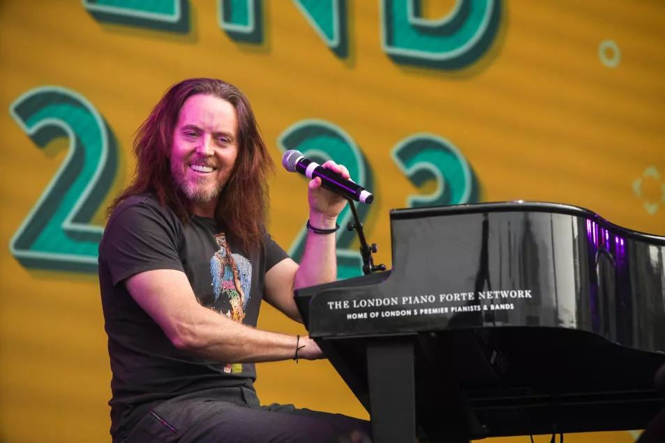 Tim Minchin performing on stage