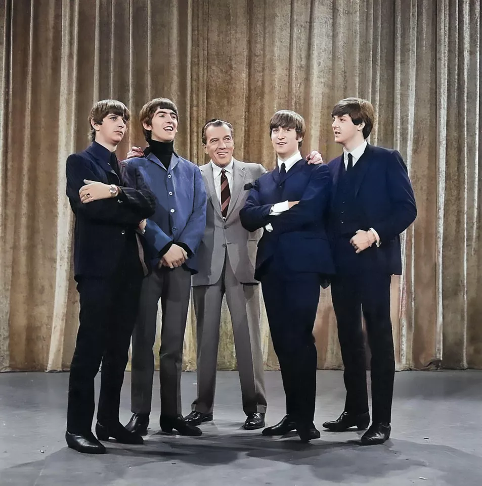 The Beatles with Ed Sullivan on stage for a TV appearance in New York