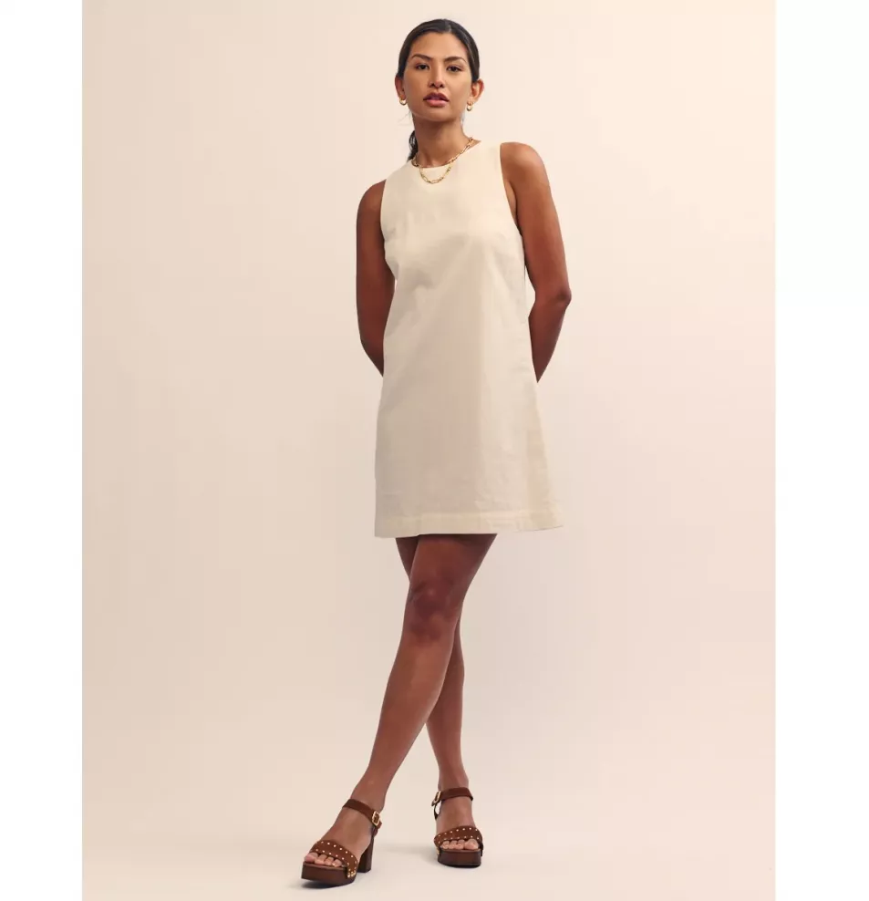 Model wears cream cotton mod shift dress