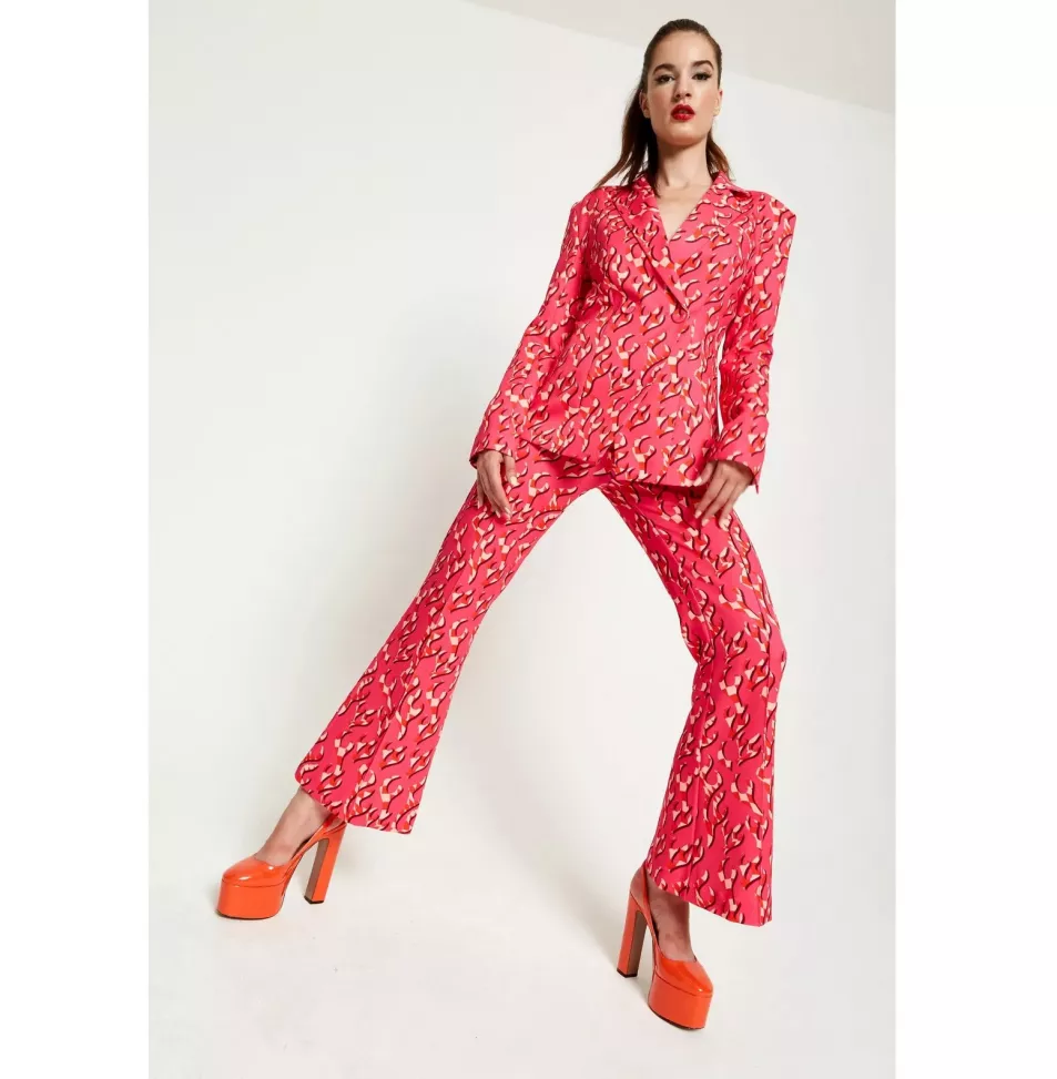 Model wears pink and orange Sixties inspired suit