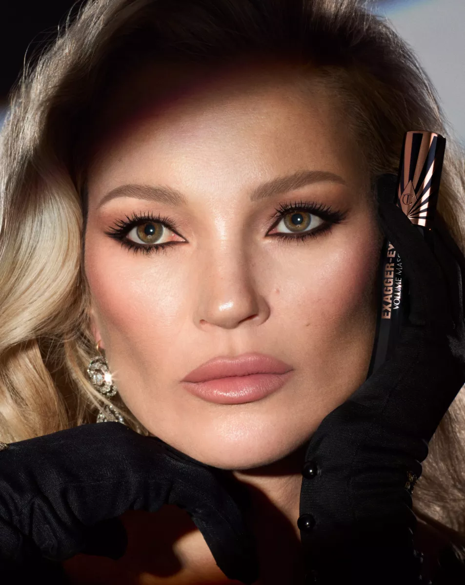 Kate Moss poses with black cat eye 