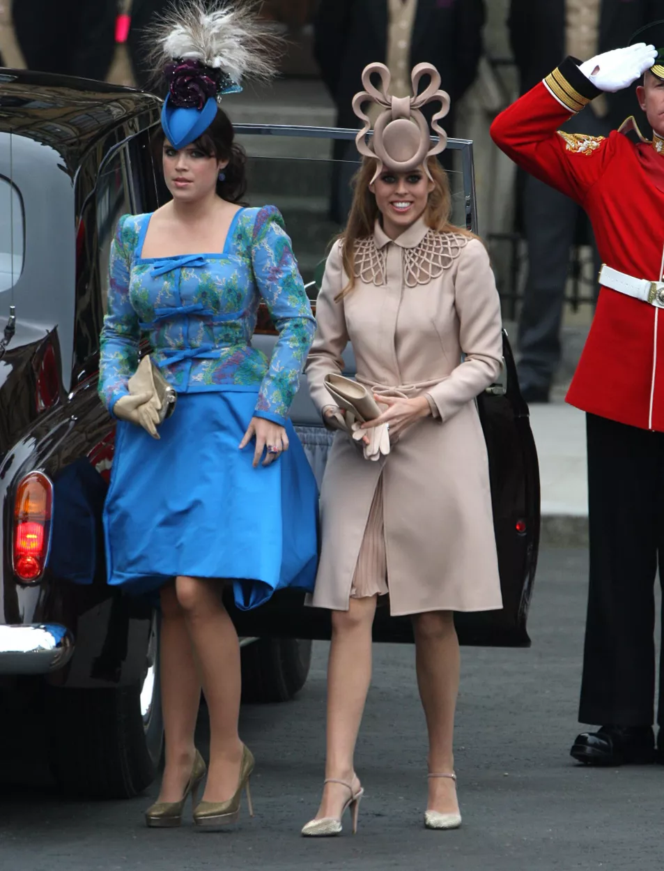 Princess Beatrice and Princess Eugenie walk out of black cab on the way to William and Kate's wedding