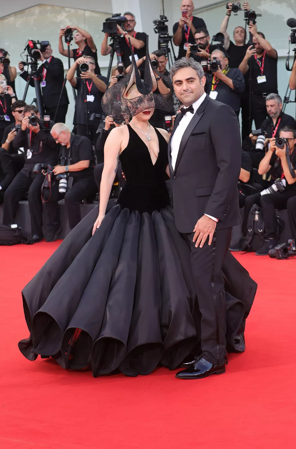 Lady Gaga and Michael Polansky pose for photographers upon arrival for the premiere of the film ‘Joker: Folie A Deux’ 