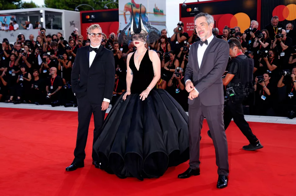 Joaquin Phoenix, Lady Gaga and director Todd Phillips pose for photographers upon arrival for the premiere of the film ‘Joker: Folie A Deux’ 