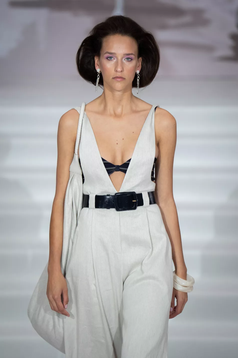 Model in linen jumpsuit on Paul Costelloe Catwalk