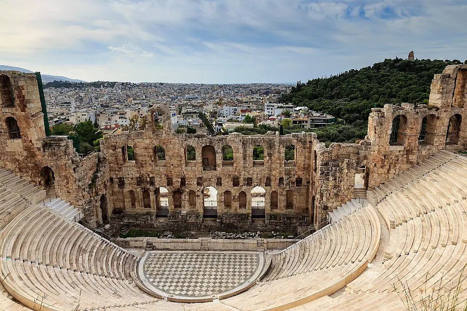 Theatre of Herod Atticus below the Acropolis with the Hill of Philippapos and city view, Athens, Greece