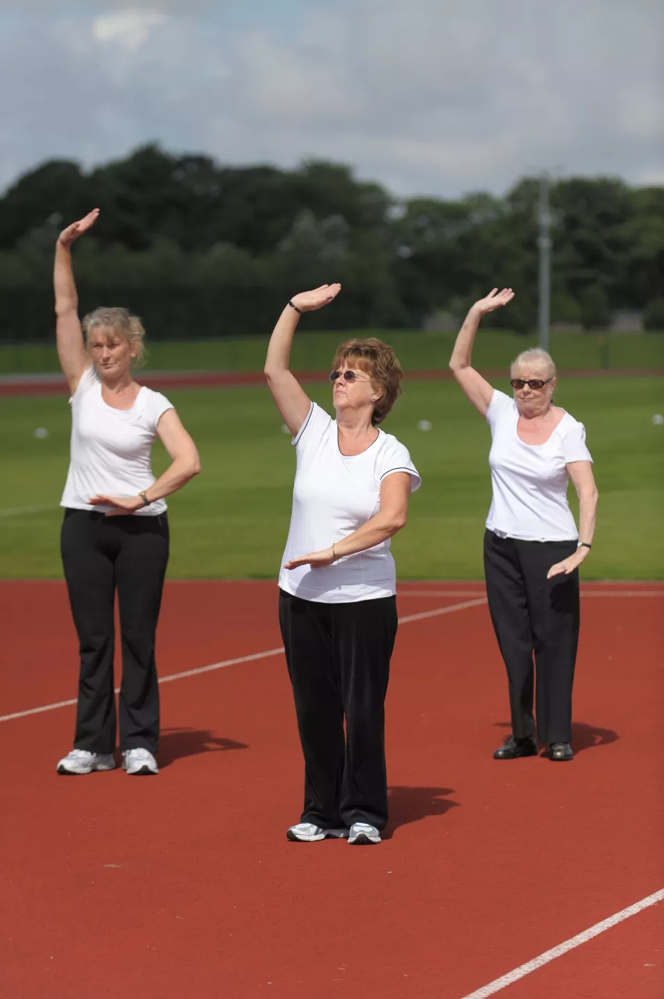 A group of older women taking part in a Tai Chai session 