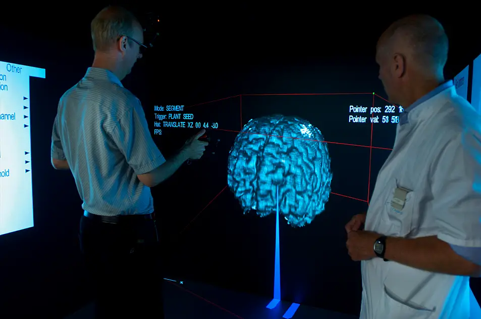 Technician helping a medical specialist with a virtual brain research calibration who is doing research on Alzheimer's Disease