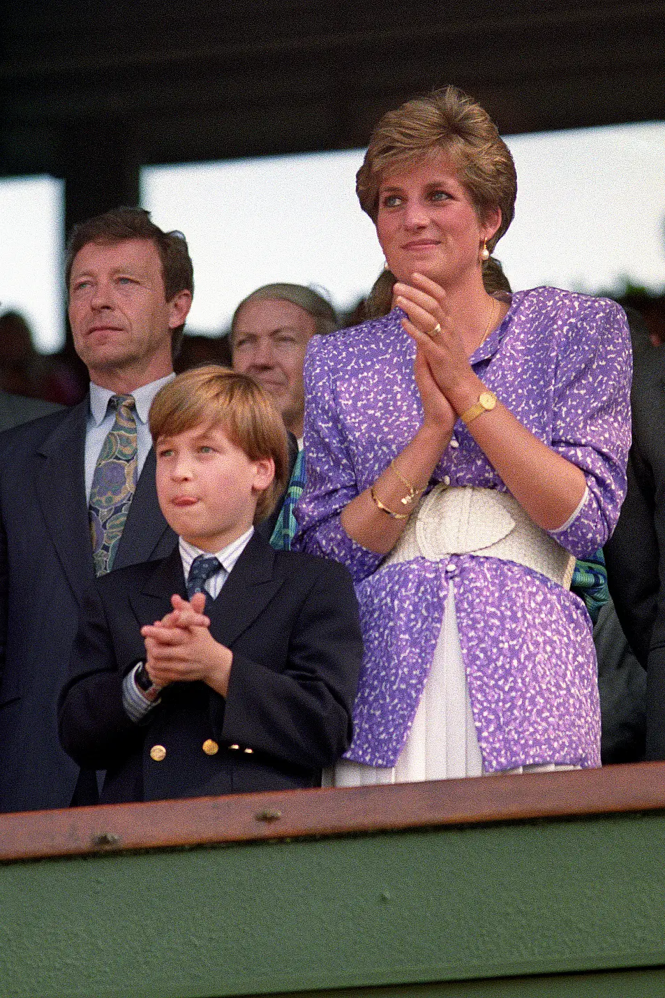 Diana, Princess of Wales and Prince William stand and applaud in the Royal Box on Centre Court at Wimbledon, as Steffi Graf wins the Women's Singles Championship.