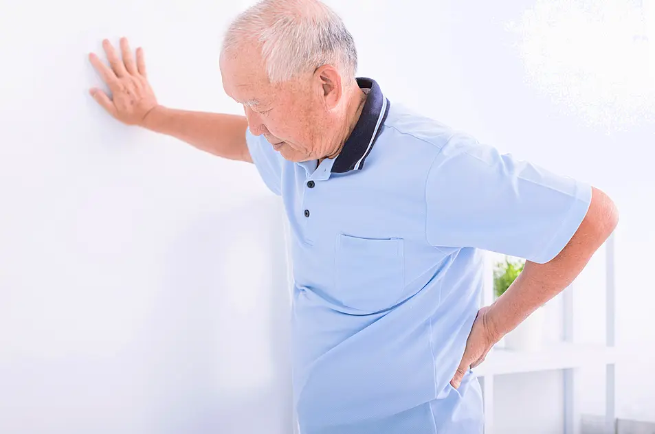 Senior man experiencing lower back pain