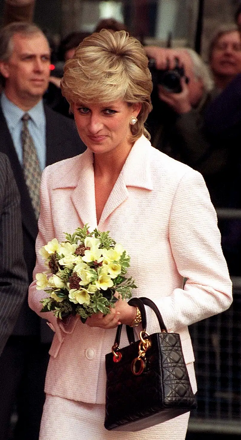 Diana carries black Lady Dior