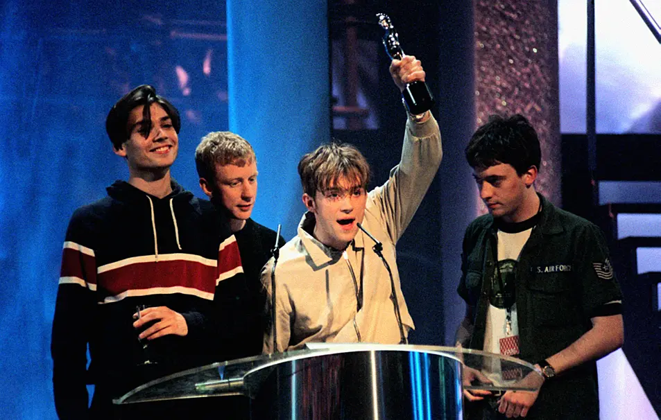 Blur winning a Brit Award for Top British Artists of the year 1995.