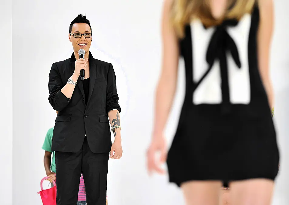 Gok Wan, host of London Gatwick Fashion Week, on the catwalk with some of the show's models.