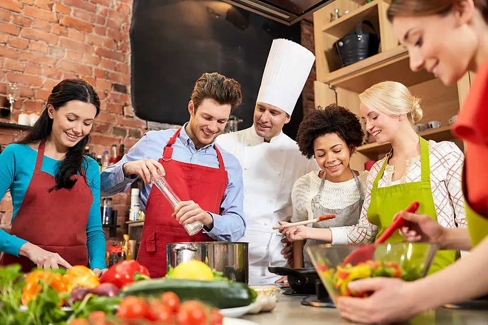 A group of friends enjoying a cooking class