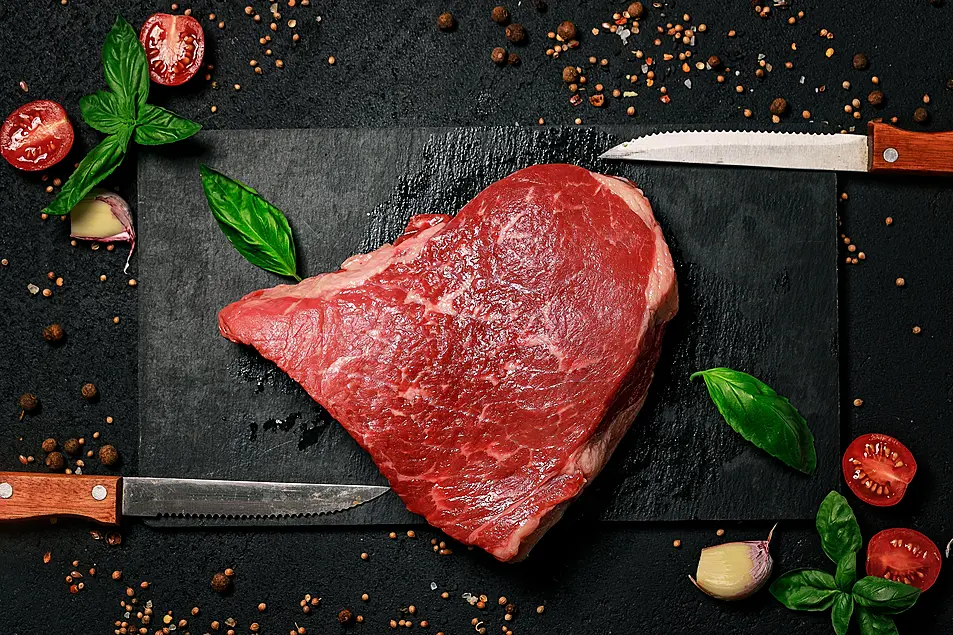  Raw beef steak on a stone cutting board