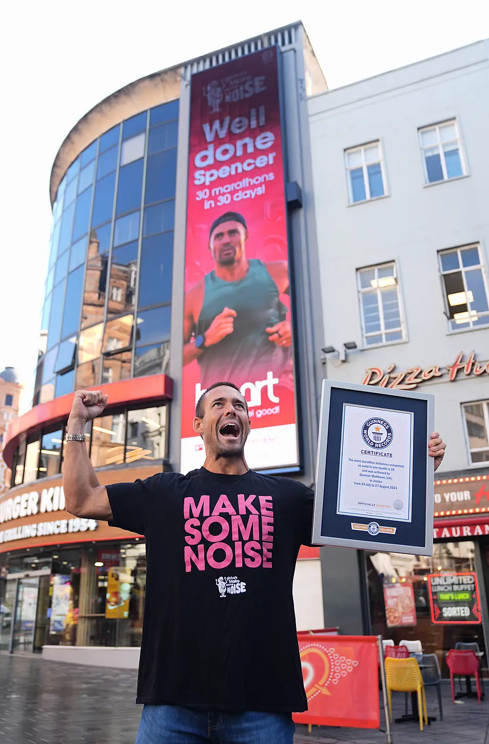 Spencer Matthews outside Global LSQ screens in London to celebrate 30 marathons in 30 days challenge and his Guinness World Record, in aid of Global's Make Some Noise