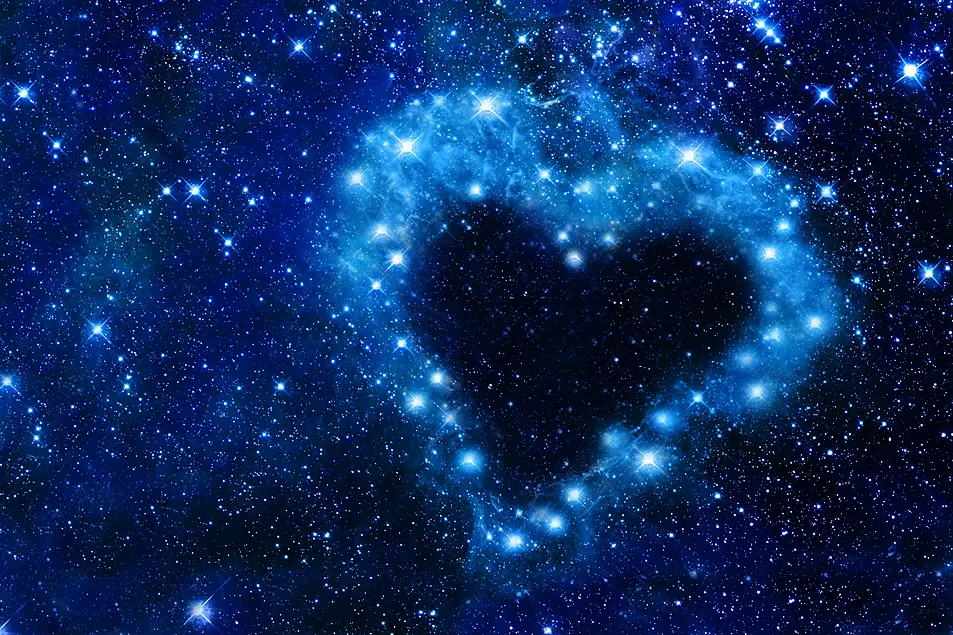 Bright stars in a night sky arranged in the shape of a heart