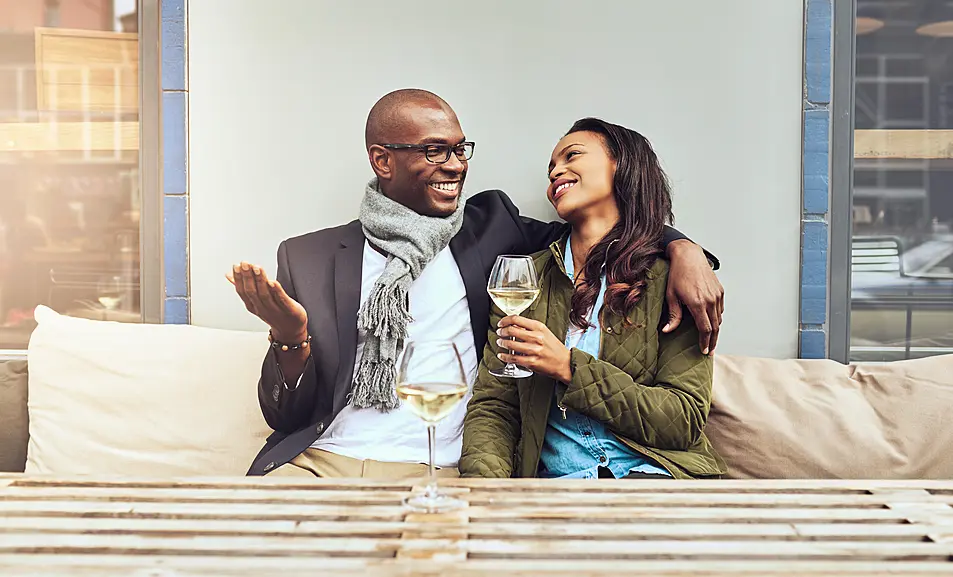 Couple on a date enjoying a glass of wine