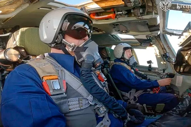 Vladimir Putin in the co-pilot’s seat of the plane 