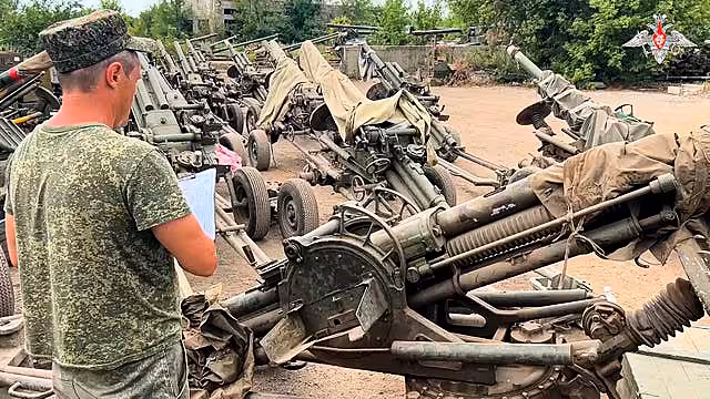 Artillery systems belonging to Russia’s Wagner military contractor are parked at an undisclosed location ahead of their handover to the Russian military 