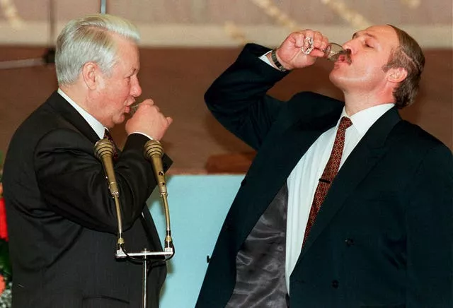 Boris Yeltsin, left, and Alexander Lukashenko drink a toast