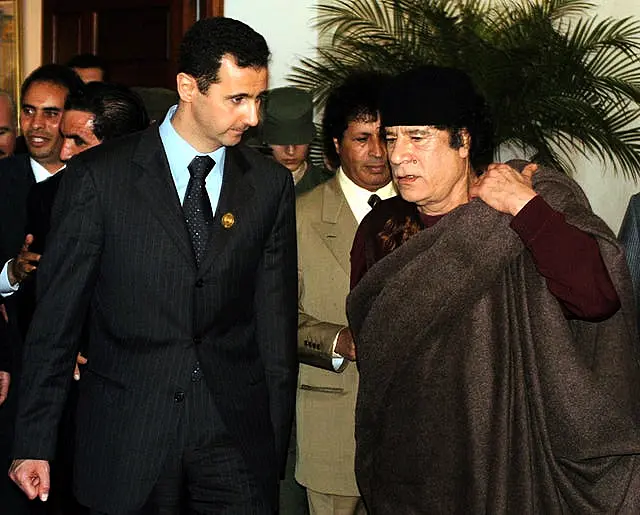 Bashar Assad and Muammar Gaddafi