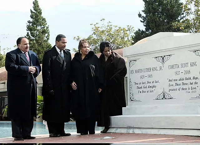 The children of Martin Luther King Jr and Coretta Scott King, from left, Martin Luther King III, Dexter King, Yolanda King and Bernice King stand next to a new crypt dedicated to their parents in Atlanta in 2006