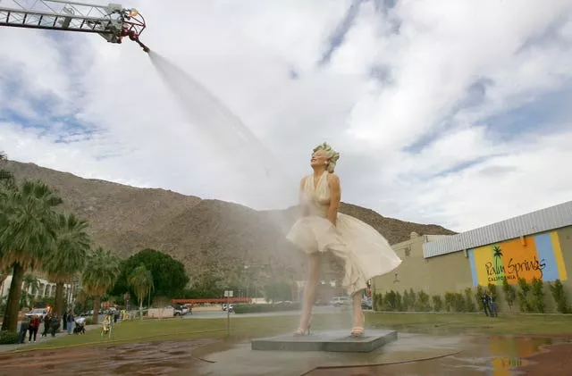 The Forever Marilyn sculpture gets a shower from the Palm Springs Fire Department in Palm Springs, California