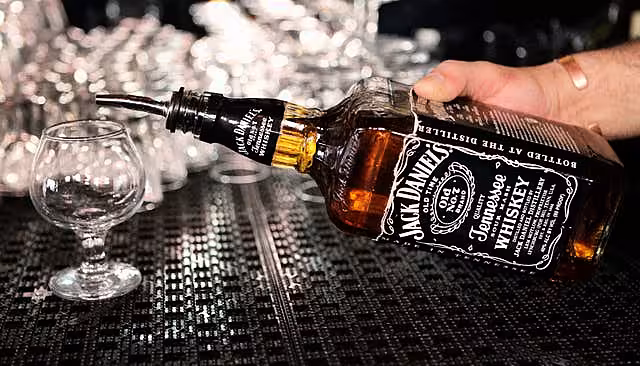 Someone pours out a Jack Daniel's