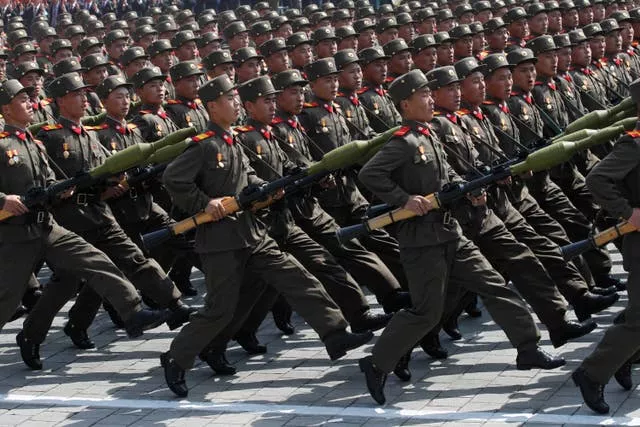 North Korean soldiers march during a mass military parade in Pyongyang’s Kim Il Sung Square to celebrate 100 years since the birth of North Korean founder, Kim Il Sung in 2012