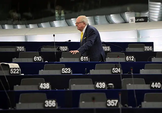 Jean Marie Le Pen looks for his seat at the European Parliament in 2014