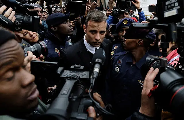 Oscar Pistorius leaves the High Court in Pretoria, South Africa, in 2016 during his trail for the murder of girlfriend Reeva Steenkamp