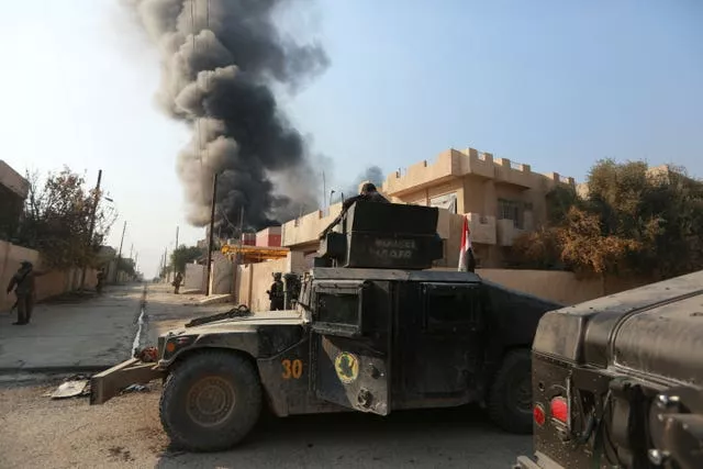 Smoke rises in al-Bakr