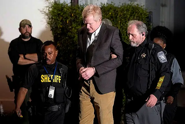 Alex Murdaugh is led outside the Colleton County Courthouse by sheriff’s deputies after being convicted of two counts of murder 