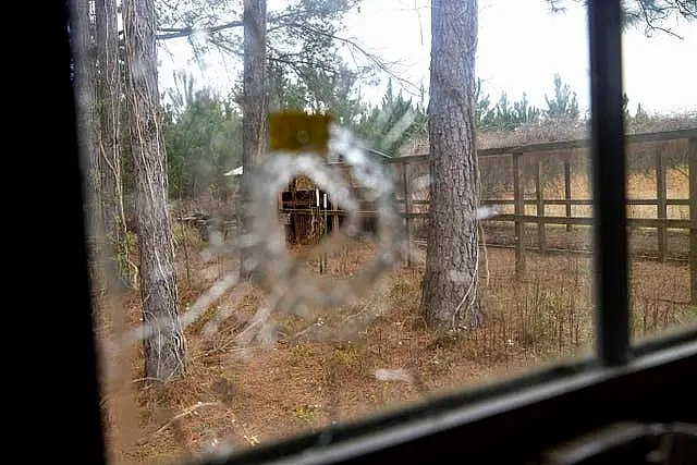 A bullet hole is seen from inside of the feed room at the Murdaugh Moselle property on Wednesday, March 1, 2023 in Islandton