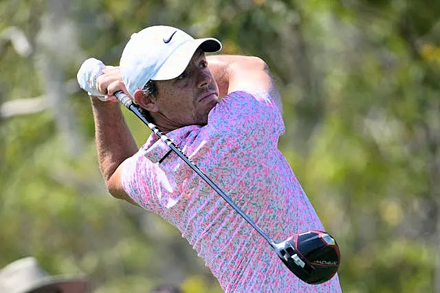 Rory McIlroy, of Northern Ireland, tees off on the third hole during the first round of the Arnold Palmer Invitational golf tournament