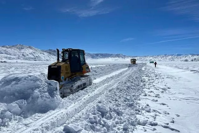 Snow is cleared from a road in California 