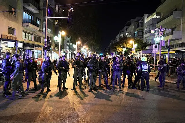 Israeli police block a shooting attack site in Tel Aviv