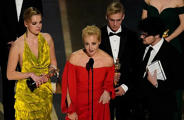 Yulia Abrosimova, second from left, and members of the crew from Navalny accept the award for best documentary feature film at the Oscars at the Dolby Theatre in Los Angeles 