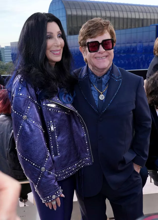 Cher (L) and Elton John