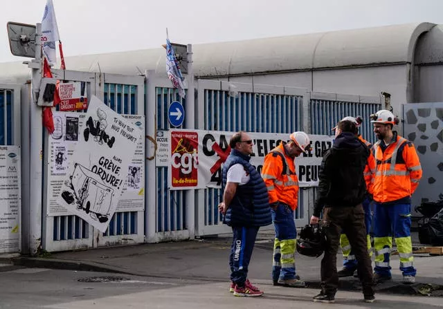 Municipality workers block the entrance of a waste incarnation plant in Paris