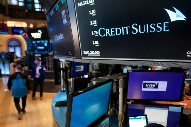 A sign displays the name of Credit Suisse on the floor at the New York Stock Exchange in New York, 